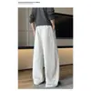 Calça de moletom retrô americana 2026 com cordão, solta e casual, design de retalhos, perna larga, estilo de perna curva, high-street, versátil e esportiva