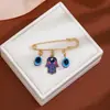 Broche de Borla Ojo del Diablo con Pedrería Creativa Europeo y Americano para Mujer, Pin de Estilo Vintage para Ceñir la Cintura de Suéter Ojo Azul de Alta Gama