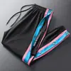 Pantalones de Botones "Americanos" Transfronterizos Otoño Invierno para Hombre con Botones Completos Entrenamiento de Baloncesto Deportivos Pantalones Largos Botón Liberación Rápida Salida de Cancha Holgados