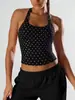Conjunto esportivo europeu e americano de sutiã sem costura de alta elasticidade em nylon com bolinhas e gola halter, e calça justa de cintura alta que levanta o bumbum