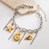 Moda Europea y Americana Ins Serie Marina Pulsera de Acero de Titanio Femenina Estrella de Mar Caracola Tortuga Flor Amor Colgante Pulsera