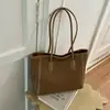 Bolso de mujer tejido de alta gama con patrón vintage 2026 nueva moda bolso de hombro de gran capacidad bolso tote de cubo para el trabajo