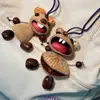 Encantador perrito peludo con la lengua fuera, llavero para bolso, colgante de dibujos animados natural, semillas de terapia de sonido curativas, popular en zonas escénicas, amuleto divertido y adorable