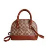 Marea Transfronteriza 2026 Otoño Temprano Nuevo Bolso de Mano Elegante Versátil Bolso Tipo Concha Bolso Cruzado de Hombro Único para Mujer con Estampado de Diseño de Nicho
