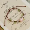 Jingdezhen Navidad Pulsera de Cuerda Trenzada de Cerámica Pulsera de Trébol de Cuatro Hojas Joyería Artística Hecha a Mano Venta al por Mayor Pulseras de Cerámica para Atracciones Turísticas