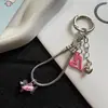 Colgante de salchicha en forma de corazón rosa pálido, dulce y fresco, cadena para teléfono de hueso de serpiente, llavero de dibujos animados lindo y charm para bolso