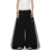 Pantalones de chándal deportivos de retazos a rayas para mujer y hombre, pantalones de baile holgados de pierna ancha para otoño, pantalones versátiles y adelgazantes de largo completo