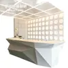 Mostrador de recepción de yeso facetado geométrico, popular en salas de exposiciones, mostrador de recepción GRG de forma irregular, caja registradora moderna minimalista, hecho a medida