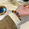 Qiaoen Flor de Goma Vermelha Natural Amethysto Amarelo Translúcido Torre de Cristal Design Simples Pulseira Versátil