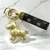 Llavero de Dinero Año del Caballo, Moneda de Oro Sólido, Colgante de Caballo Pequeño, Adorno para Bolso y Coche del Año del Zodiaco, Regalo de Año Nuevo