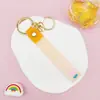 Llavero Colgante de Cordón de Cuero con Letra Transparente Brillante con Accesorios Estilo Muñeca Rellena de Aceite Encanto de Llavero Pulsera Venta al por Mayor
