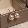 Nuevos pendientes de perlas de chocolate con nicho francés retro ligeros de lujo de alta gama con gancho para la oreja, elegantes accesorios para las orejas que combinan con todo.