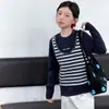 Conjunto de Otoño para Niñas 2026 Nueva Moda Estilo Coreano Top Rayado de Dos Piezas Falsas y Jeans para Niños Mayores