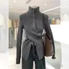 Suéter de punto de cachemir gris europeo de cuello alto para mujer en otoño e invierno con cintura asimétrica y abertura en la parte superior
