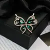 Moda europeia e americana novo broche de borboleta com diamantes de alta qualidade temperamento feminino alfinete requintado corsage da moda joia de cristal