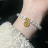 Venta al por mayor de fábrica Pulsera marca Sun Shi Fu Piedra Ojo de Gato Pulsera marca Fu sonido de temblor comercio electrónico una generación de envío