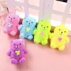 Dibujo animado flash Oso sentado pellizcar música juguete de descompresión puesto de moda transfronterizo oso de peluche luminoso juguete de desahogo venta al por mayor