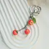 Lindo llavero de simulación naranja pequeño colgante de resina pastoral con dibujos animados bolso con auriculares joyería colgante regalo