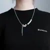 Dulce fresco reflectante Perla mariposa borla collar femenino titanio acero costura nicho diseño alta calidad moda todo-partido hip hop