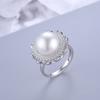 Europa y Estados Unidos anillo nuevo transfronterizo de plata S925 con perla ajustable moda simple micro engaste circonita anillo de flor joyería