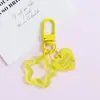 Llavero con hebilla de puerta giratoria, colgante de pentagrama y corazón transparente de colores, accesorio hecho a mano para bolsos