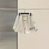 Shorts de Nylon Reflectantes con Letras Fog Essentials para Pareja Pantalones Sueltos de Tres Cuartos Pantalones Finos para Hombre