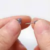 Venta caliente transfronteriza aretes de circonita de cuatro garras de una pieza tornillos externos acero titanio aretes piercing para el cuerpo humano fábrica en stock venta al por mayor