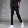 Envio RápidoCalças Grossas de Outono Masculinas com Zíper Lateral, Múltiplos Bolsos, Cintura Alta Elástica, Calças de Moletom com Caimento Solto, Calças Esportivas