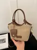 Bolso de mano de mujer de alta gama, nicho, estilo vintage, de importación, nuevo bolso de hombro de moda 2026, bandolera tipo cubo versátil