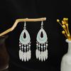 Pendientes geométricos redondos de estilo étnico transfronterizo europeo y americano, con borlas largas y atracciones turísticas retro bohemias.
