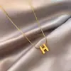 Collar de cadena de hueso de serpiente letra H acero de titanio cadena de clavícula de alta calidad para mujer cadena de suéter que no se decolora accesorios de estilo frío al por mayor