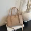 Elegante bolsa de mão em formato de concha para mulheres, nova moda de verão 2026, bolsa versátil para ombro e transversal para o dia a dia