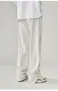 Calça casual nova de outono e primavera com zíper lateral e fenda calça esportiva masculina de cor sólida calça de moletom reta 2023