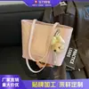 Elegante y texturizada nueva bolsa tote de gran capacidad para ir al trabajo, 2026 bolso de hombro casual con patrón tejido retro para mujer