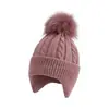 Gorro de punto grueso para adultos de venta caliente transfronterizo, color liso con pompón, cálido y a prueba de viento, gorro de punto para cubrir las orejas al aire libre