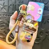 Llavero Colgante Frasco de Crema de Fresa Encanto Linda Arena Líquida Accesorio para Bolsa Regalo Pequeño para Pareja Llavero Venta al por Mayor
