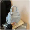 Bolsa de Concha Super Popular Transfronteiriça Feminina 2025 Nova Mais Vendida Estilo Coreano Bolsa de Ombro Texturizada Versátil Bolsa Transversal