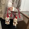 Bolso de Mano Mini Bowling a Cuadros de Moda para Mujer 2026 Navidad Lindo Coreano con Forma de Concha para Labial Auriculares