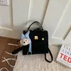 Mochila Fofa Nova Primavera 2026 Estilo Coreano Feminina Design de Nicho Alta Aparência Moda Versátil Bolsa de Ombro Único Transversal