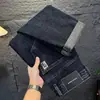Jeans para Hombre 2026 Nuevo Otoño Primavera Marca de Moda Bordados Holgados Pierna Recta Otoño Negro Gris Elásticos Casuales Pantalones Largos