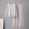 Conjunto de duas peças de malha de cor sólida com temperamento para comércio exterior transfronteiriço, suéter de gola redonda com bolso + terno de calças largas casuais soltas, feminino