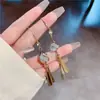 Estilo igual de influenciador do Tiktok brincos de franja longos de Opala vermelha brincos de temperamento da nova moda