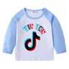2026 Nueva Camiseta Infantil Transfronteriza de Primavera y Otoño Cuello Redondo Dibujos Animados Manga Larga Camiseta Básica para Niños y Niñas Camiseta de Algodón para Bebé