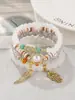 Conjunto de pulseiras multicamadas no atacado, conjunto de quatro peças de joias artesanais em vidro com contas, conjunto de pulseiras elásticas, acessório de mão com suporte de flor de ferro