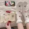 Meias femininas fofas para outono e inverno, meias sem costura de comprimento médio feitas de algodão de Xinjiang, meias compridas estilo coreano universitário com estampa de gato dos Desenhos Animados de Zhuji