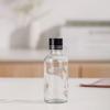 Venta al por mayor de fábrica botella de aceite de vidrio botella gotero con cabezal de arena botella de spray transparente botella de cosméticos portátil