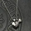 Joyería de moda Plata tailandesa Retro Corazón de doble melocotón Collar de tumba Cadena de suéter Otoño e Invierno Personalizado de Europa y América Cruz de Alta Gama