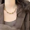 Colgante de Piedra Ojo de Tigre Retro Bañado en Oro Real de 18 Quilates Cadena para Suéter Cadena para Clavícula Moda Otoño e Invierno Collar de Alta Gama