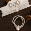 Collar y pulsera de perlas de imitación con flor de diamante francés, cadena de clavícula de nicho de moda, joyería de alta gama que combina con todo.