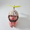 Adorno de Hucha de Coche Eléctrico Famoso en Internet Llevando un Casco, Linda Decoración de Coche, Suministro Exclusivo Transfronterizo para Motocicleta y Bicicleta